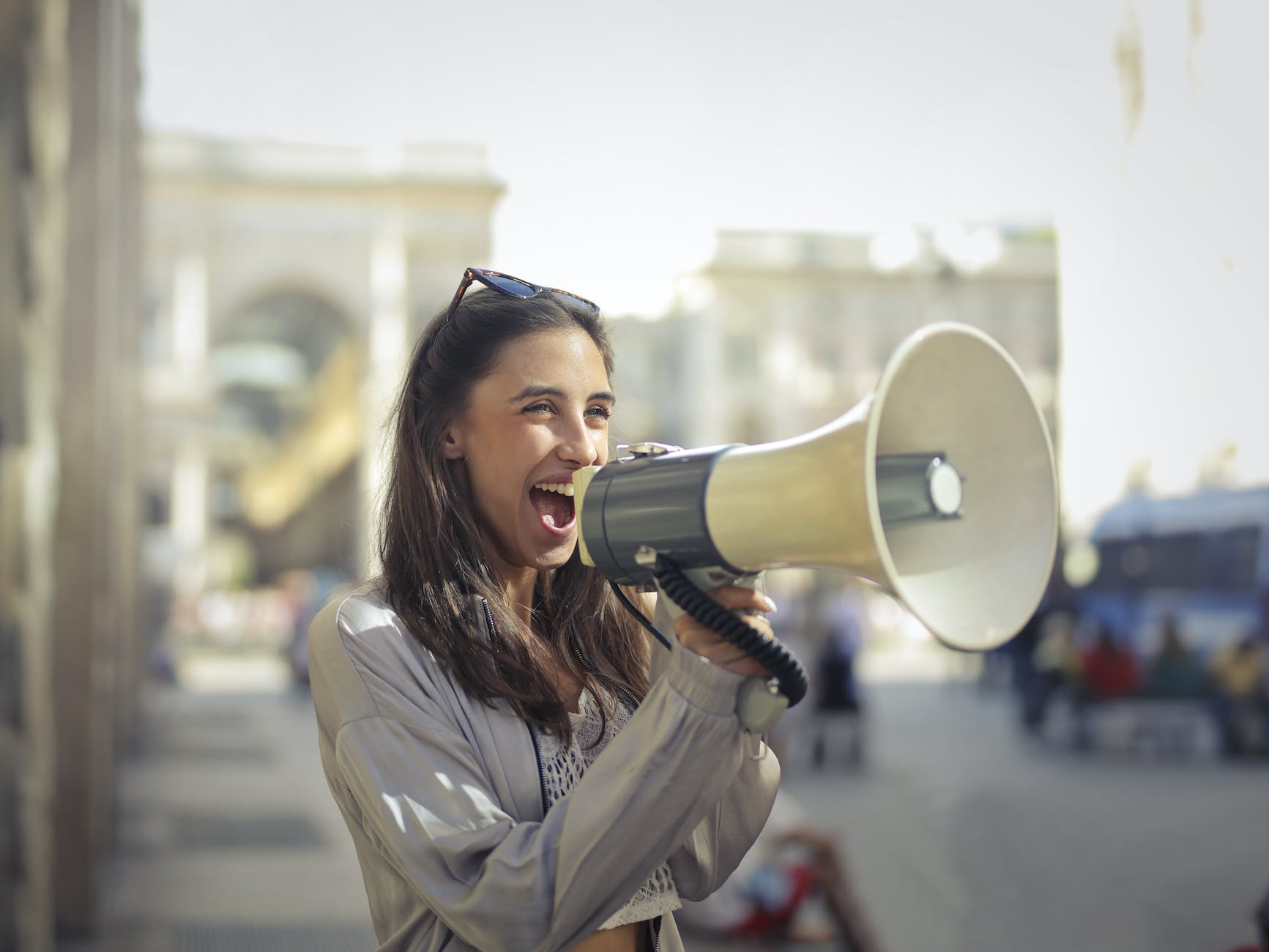 7 Surefire Ways To Increase Your Website Traffic 2 cheerful young woman screaming into megaphone
