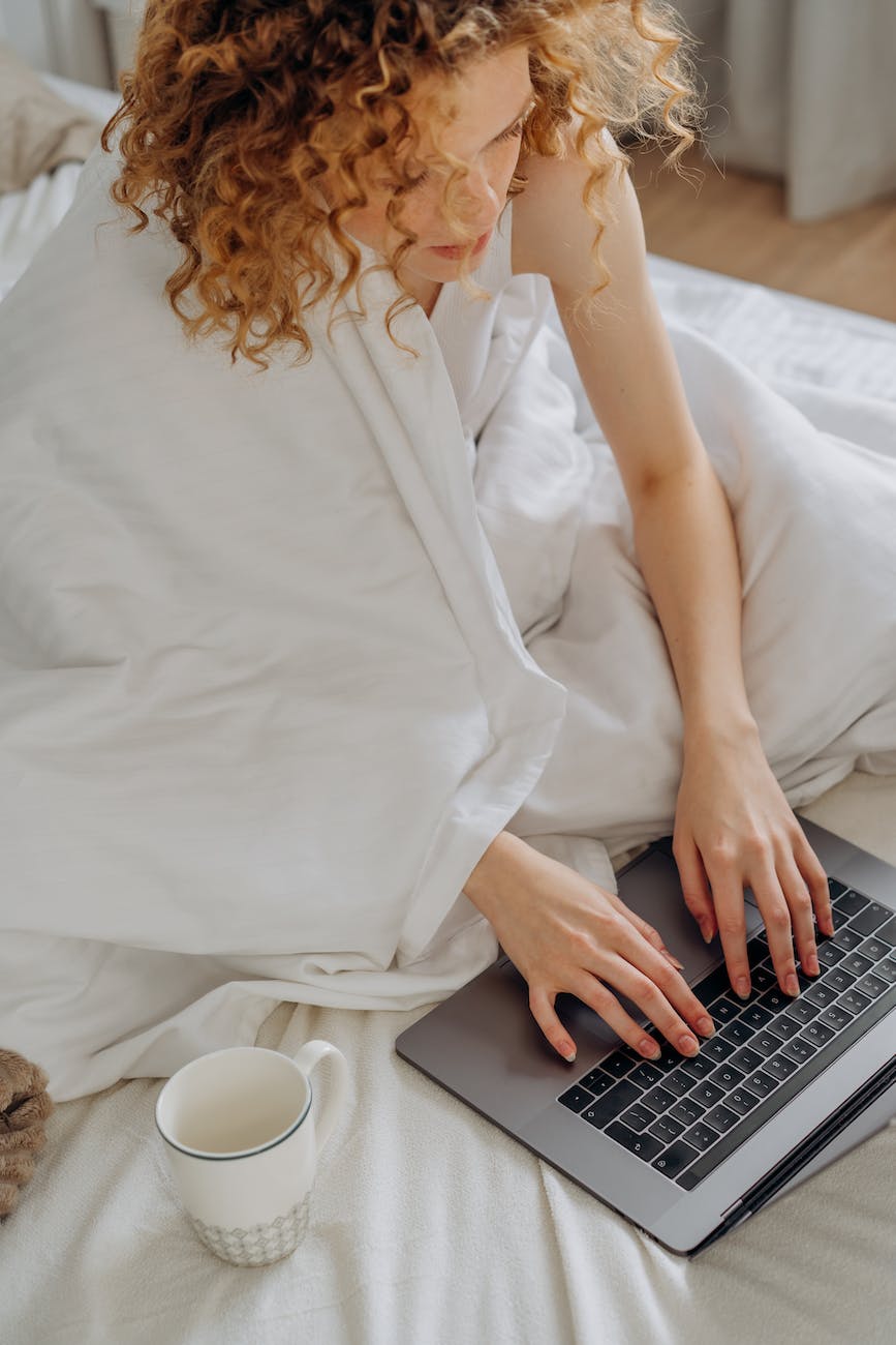 10 Rumus Google Sheets Wajib Kita Ketahui dan Contoh Penerapannya 1 woman in white sleeveless shirt using black laptop computer on bed